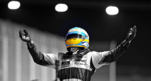 Spanish driver Fernando Alonso of Renault gestures as he win the final of the sport's first-ever night race at the Singapore Grand Prix on September 28, 2008. Spain's Fernando Alonso snapped a year-long win drought to take the Singapore Grand Prix, winning a drama-filled first ever night race as a comical error cost Ferreri's Felipe Massa dearly.     AFP PHOTO / BAY ISMOYO (Photo credit should read BAY ISMOYO/AFP/Getty Images)